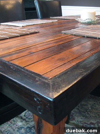 Stunning Richmond Transformation 7 Close-up detail of Eric's impressive handmade reclaimed wood dining table, highlighting its unique texture and craftsmanship.