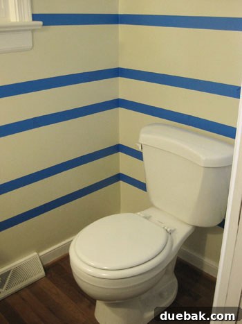 Step-by-step guide taping off stripes on the wall for painting