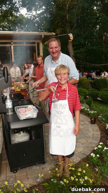 Guest enjoying a grilled burger at the wedding