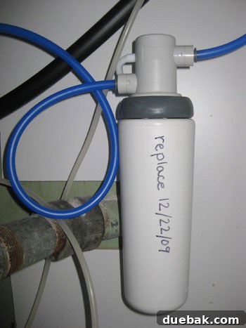 Under-sink filter attached with refill date marked