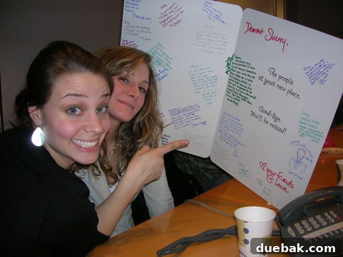 Sherry and a coworker, Heather, smiling at their going-away party in NYC.