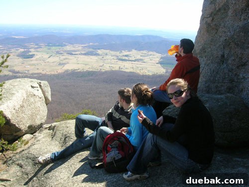 The hiking group enjoying snacks and rest at the summit of Old Rag Mountain.