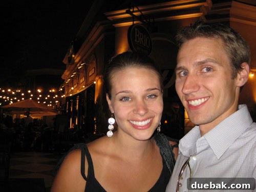 A couple looking happily full and content after a delicious second anniversary dinner at Brio Italian Grille, showcasing their post-meal satisfaction.
