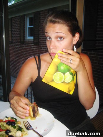 A close-up shot of someone taking a bite of a delicious meal, mouthwatering and visibly enjoyable, perfectly conveying the 'dee-licious' experience of the anniversary dinner.