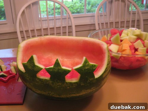 Carving stars into a watermelon for a fruit basket