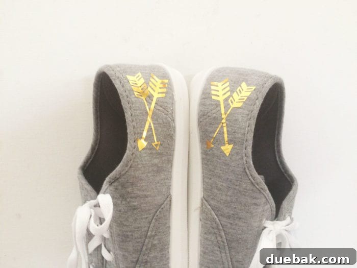 Another angle of the personalized grey shoes with gold arrows, highlighting the custom detail and craftsmanship
