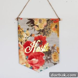 A fabric banner customized with metallic gold iron-on vinyl, displaying a festive message or design