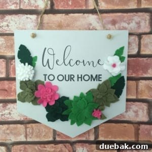 A unique felt succulent wreath adorned with vinyl elements, showcasing mixed media crafting