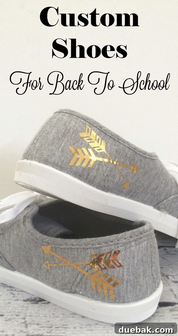 A wide shot of the personalized grey sneakers with gold arrows, emphasizing the overall aesthetic and custom look
