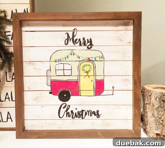 Close-up of a rustic Christmas pallet sign with festive graphics