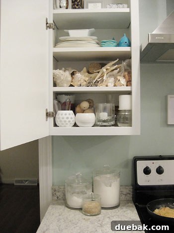 The Secret to Straight Candlesticks 2 A cabinet filled with various home decor items, organized as a 'Decor Store'