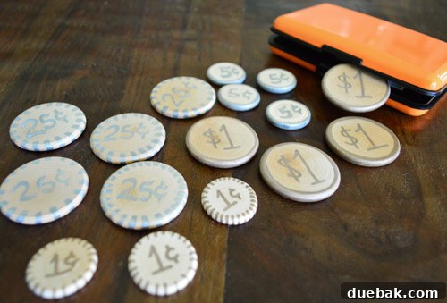 Metallic markers and wooden discs for crafting play money