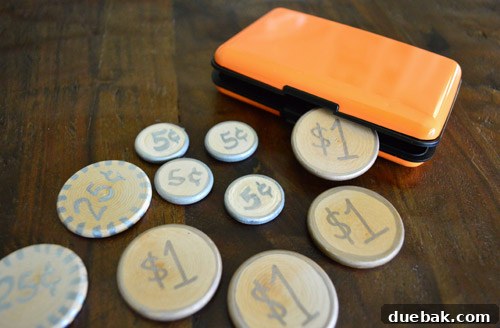 Homemade wooden play money gifted in an orange case