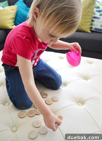 Child playing with homemade wooden coins