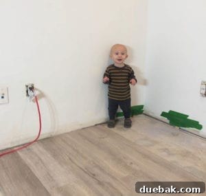 Children playing on new vinyl plank flooring, illustrating durability