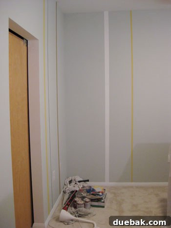 Crafting Your Perfect Nursery 6 Newly painted vertical stripes on the nursery wall, showing vibrant colors