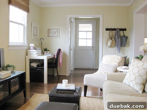 Transform Wood Paneling with Paint for a Modern Look 6 After painting the wood paneling, illustrating a brightened and modernized den