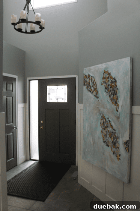 Elevate Your Entryway: Mastering Front Door Installation 13 Interior view showing the new front door with frosted sidelights, bringing in natural light.