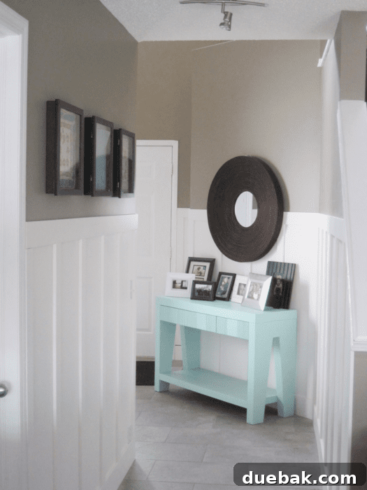 Elevate Your Entryway: Mastering Front Door Installation 6 Another angle of the brightened entryway with decorative elements.