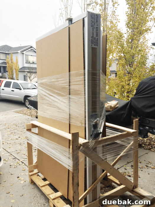 Elevate Your Entryway: Mastering Front Door Installation 7 New Masonite door unit arriving, standing upright to protect glass.