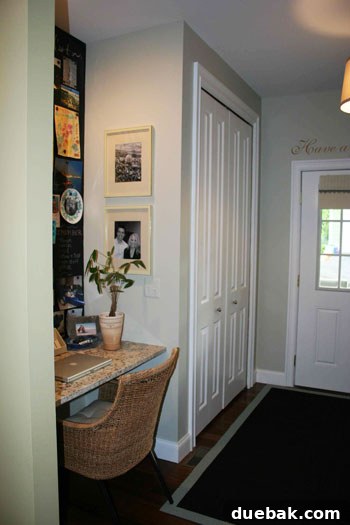 Close-up of the DIY lockers in the mudroom, showing the bench, dog bed area, and organized cubbies.
