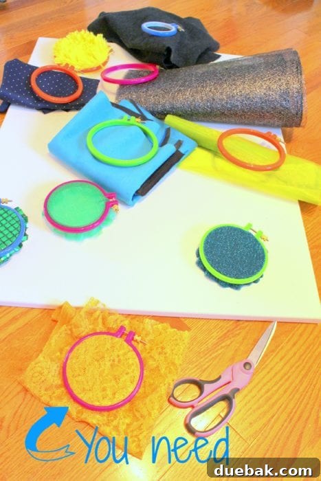 Close-up of embroidery hoops and various fabric swatches, ready for sensory board assembly