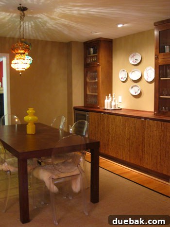 Eco-friendly built-in cabinetry in the dining room made from sustainable wood, featuring thoughtful storage solutions and an integrated wine chiller, showcasing luxury and sustainability