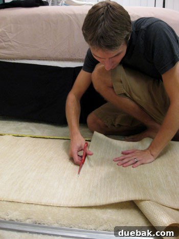 DIY privacy screen step 1: Measuring and cutting grasscloth panel for sliding door.