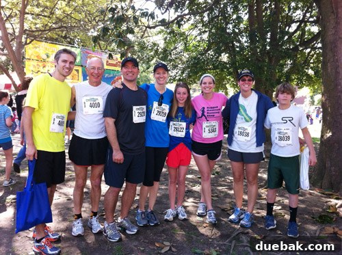 Family members cheering on runners with cowbells