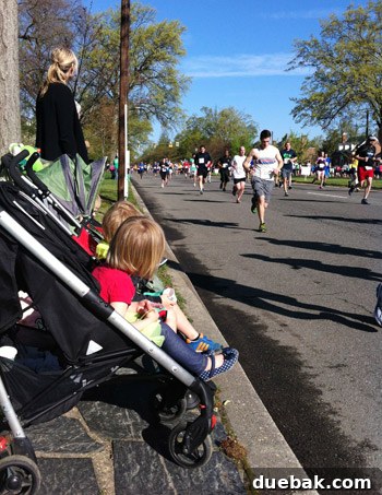 Close-up of children sitting calmly in strollers during the race