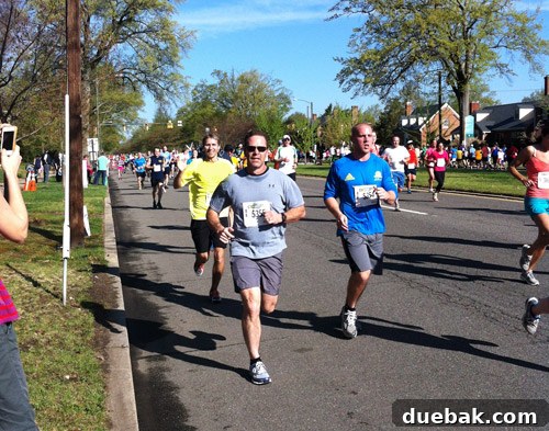 Runner mid-race receiving a boost from seeing family