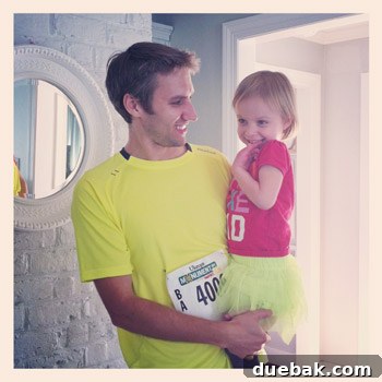 Close-up of Clara's 'Rad Like Dad' shirt and neon tutu