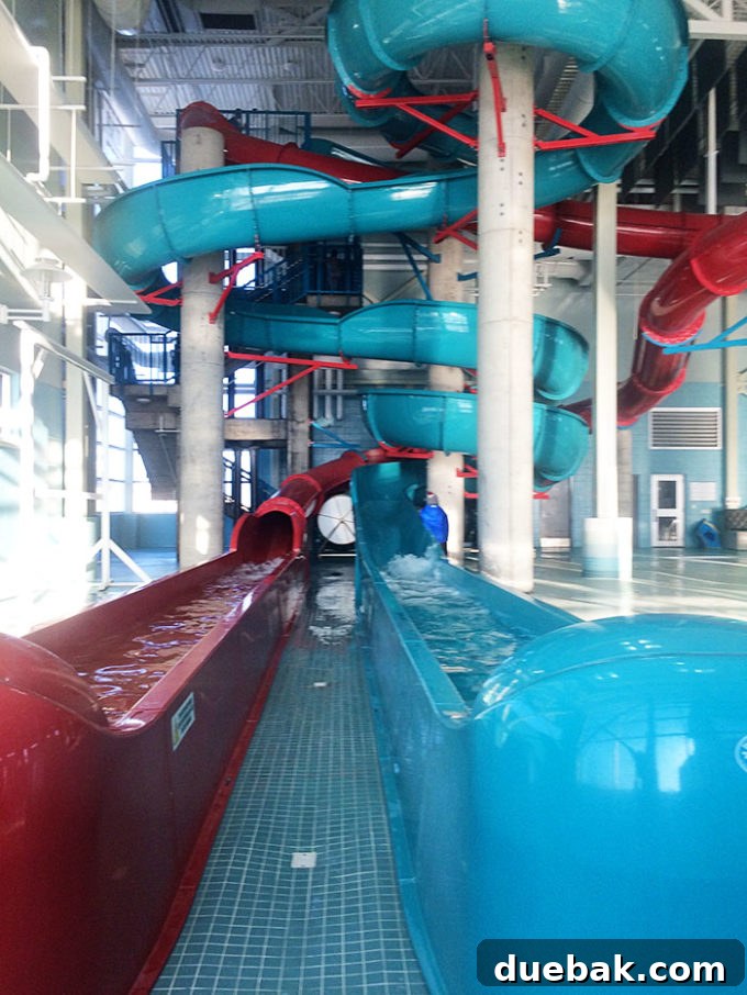 Families enjoying the Manluk Centre Board Rider surfing pool in Wetaskiwin, an affordable and fun activity.