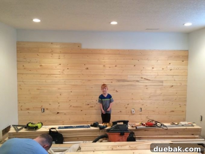 Basement Playroom Transformation with Shiplap and Behr Paint 4 Close-up of shiplap installation process