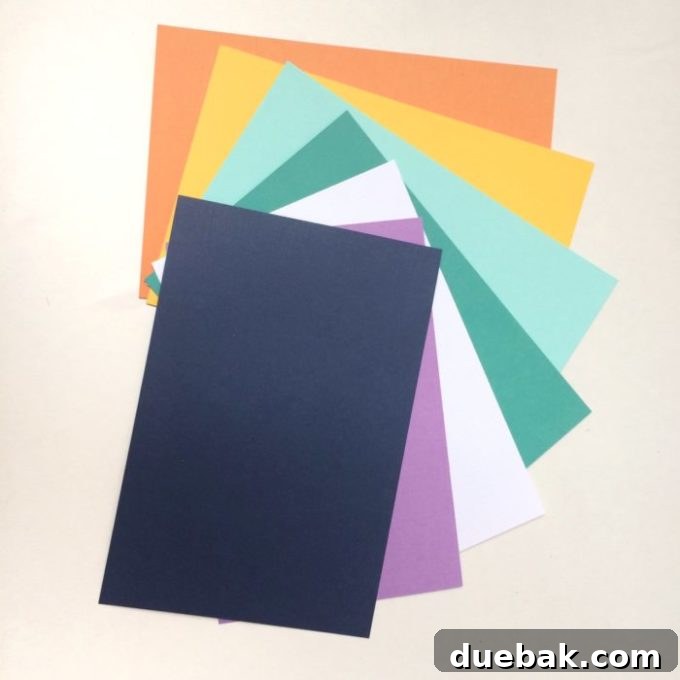 Close-up view of pre-cut paper flowers and colored cardstock included in the iPhone case craft kit