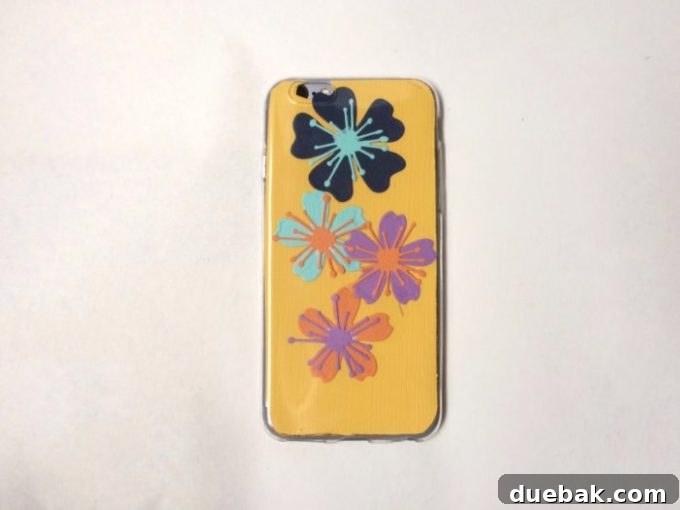 Completed custom iPhone case with paper flower design, showcasing the vibrant colors and unique pattern