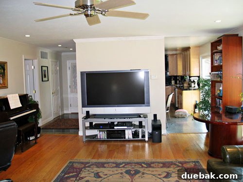 Another angle of Amy's living room before the design overhaul, highlighting the original fireplace
