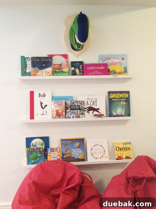 Detail of white bookshelves in the basement playroom reading nook