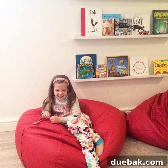 Bright Basement Playroom Reveal - book ledges and leather bean bags