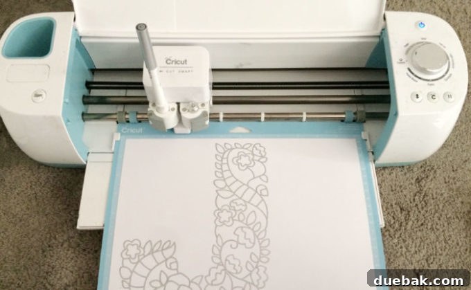 Screenshot from Cricut Design Space showing a design selected and sized within a guide rectangle, with layer attributes highlighted.