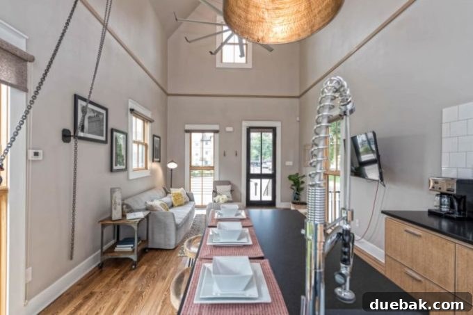 Spacious living room with vaulted ceiling in the Fixer Upper Shotgun House