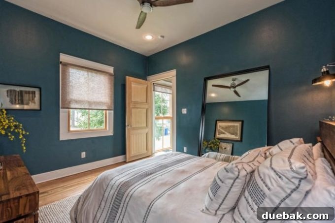 Bedroom view showing furniture and decor in the Fixer Upper Shotgun House