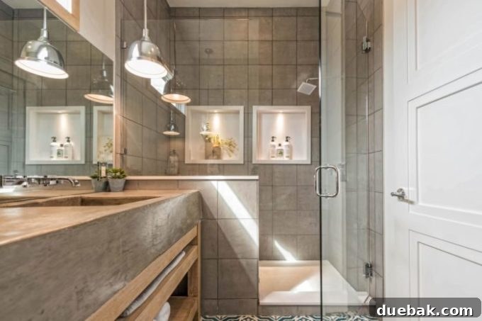 Close-up of the elegant shower tile and built-in shelves in the Fixer Upper Shotgun House