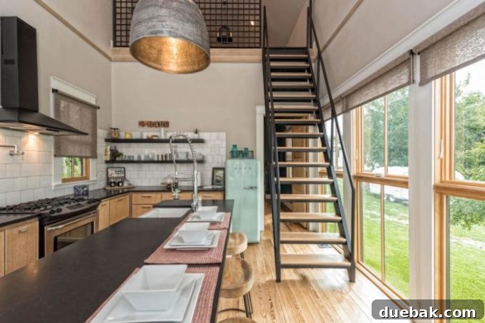 Compact yet stylish kitchen in the Fixer Upper Shotgun House with floating shelves