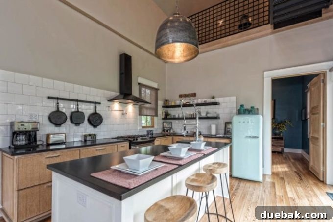 Fixer Upper Shotgun House kitchen featuring a charming mint green Smeg fridge