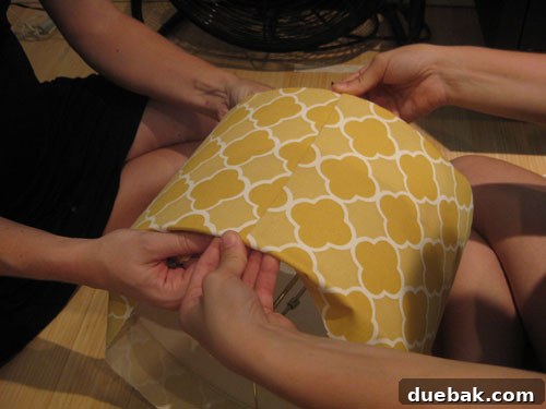 DIY Fabric Lamp Shade Makeover 11 Fabric tightly wrapped around the lampshade, with the seam being formed.