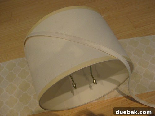 DIY Fabric Lamp Shade Makeover 8 Lampshade with its top and bottom banding removed, showing a clean surface.