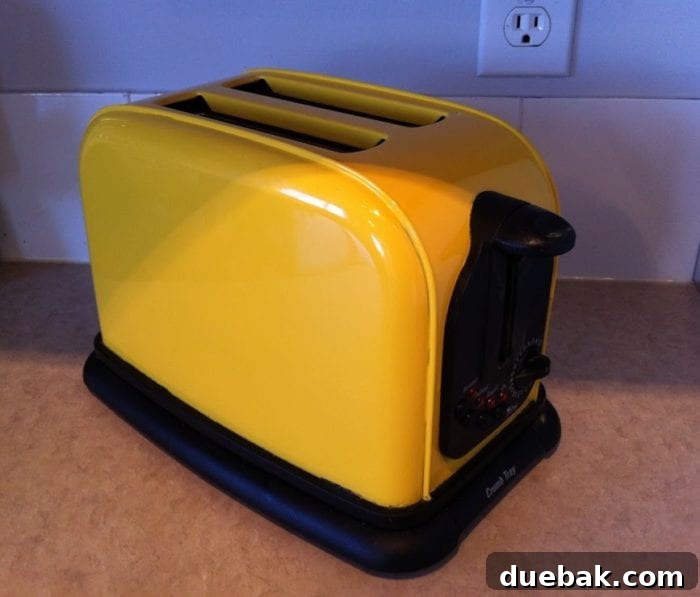 Bright Yellow Toaster: A $10 DIY Paint Project 5 A beautifully designed kitchen with thoughtful touches of color, including a glimpse of the yellow toaster.