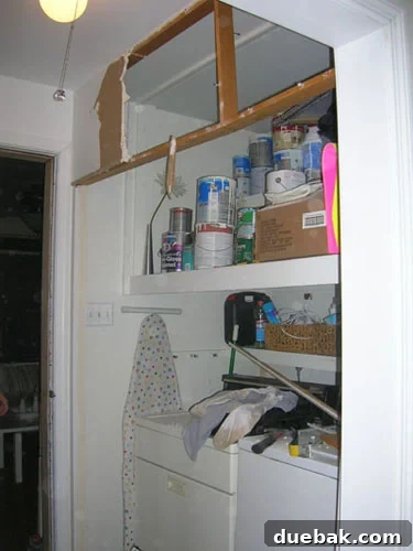 Our Ranch Home Blueprint 7 final-laundry-nook-before - Mid-demolition of laundry area, showing old bifold doors and wall