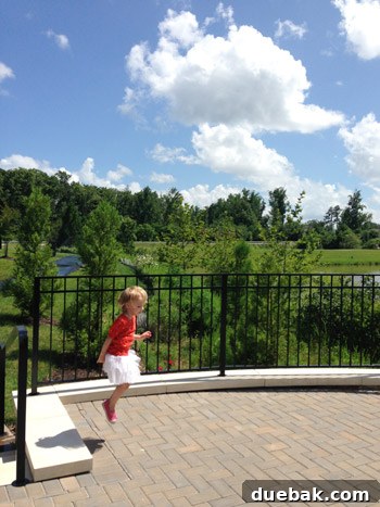 Family walking through a park on a sunny Fourth of July